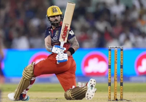 Virat Kohli's ton propels RCB to league leaders position.