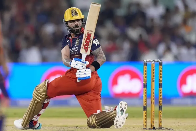 Virat Kohli's ton propels RCB to league leaders position.